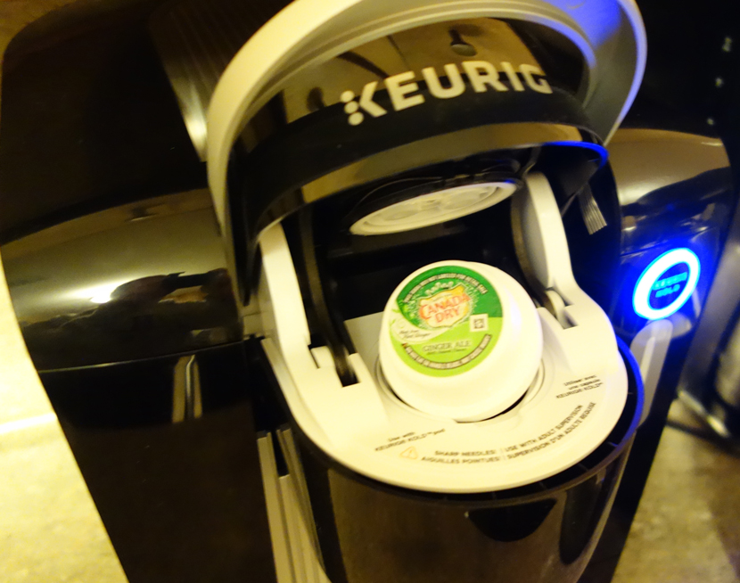 Keurig KOLD Drinkmaker on Counter with Canada Dry Ginger Ale Pod
